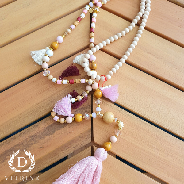 Collier pompons rose